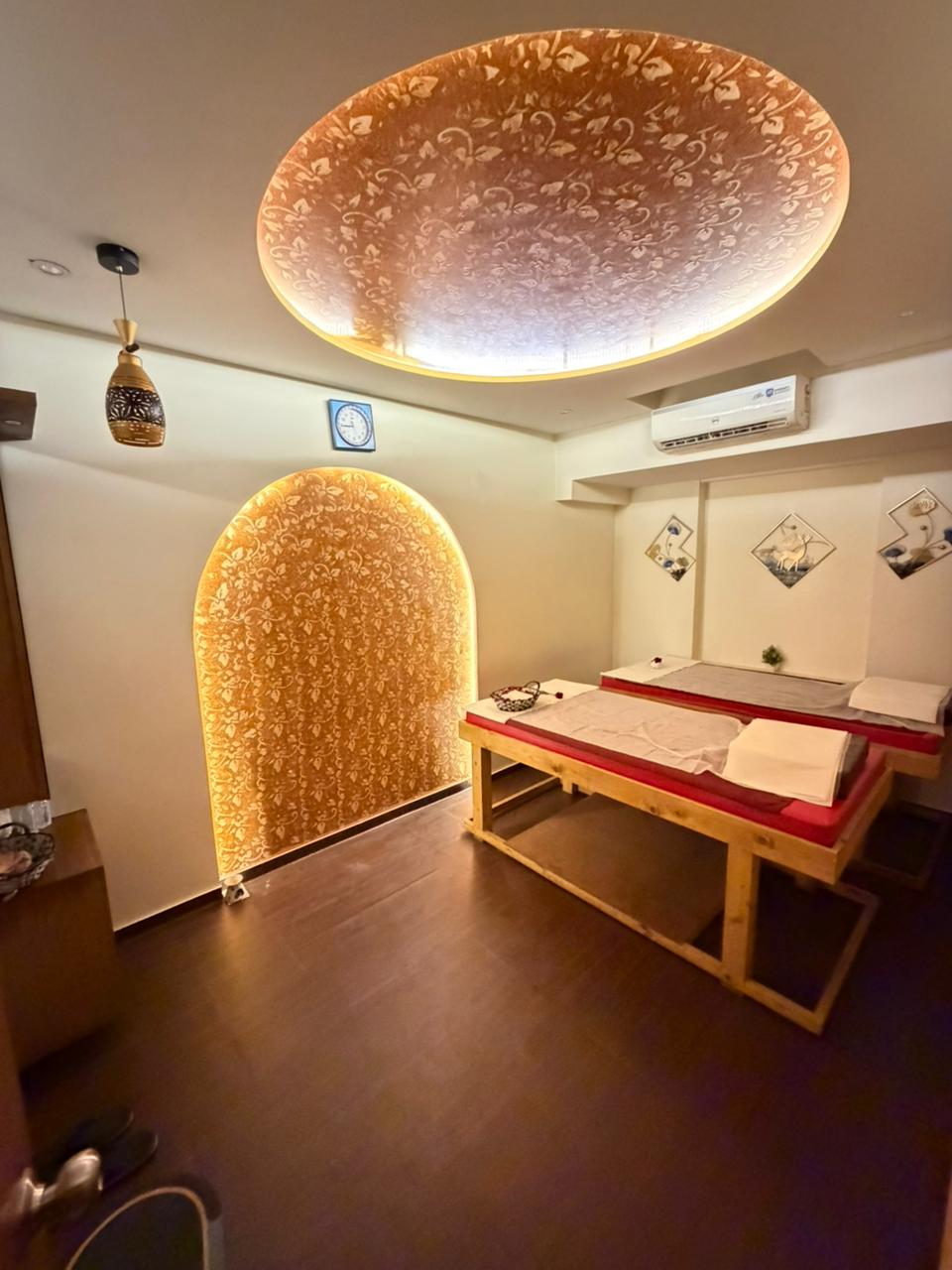 Private treatment room with golden lighting