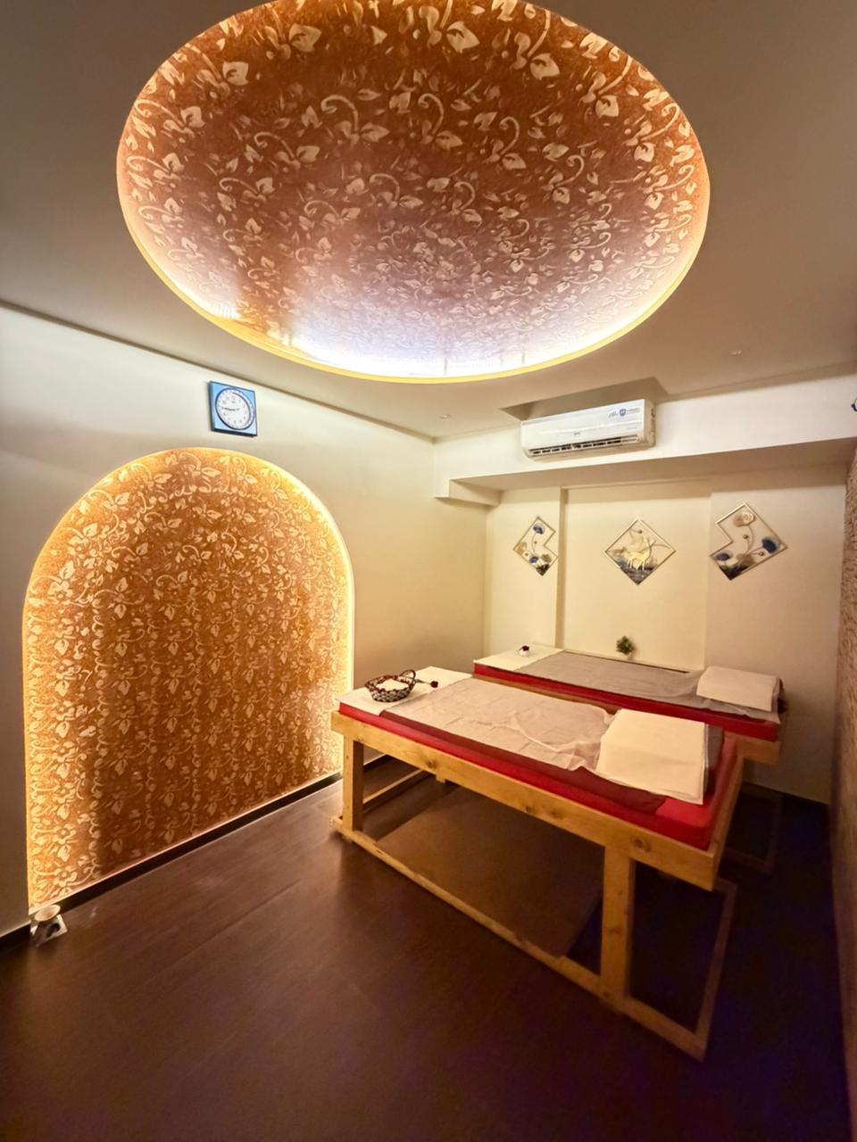 Treatment room with a glowing golden arch